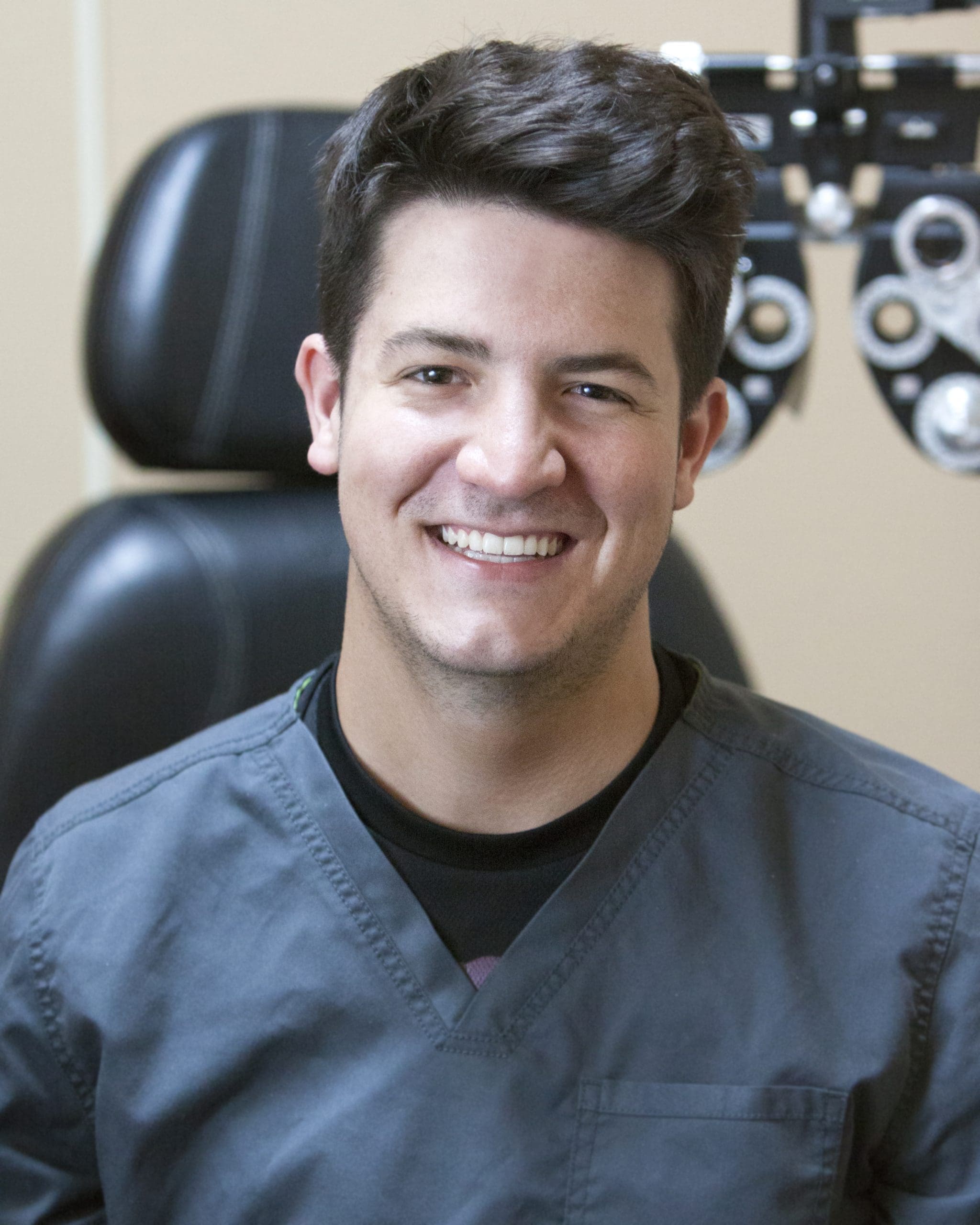 A man smiling in front of an eye doctor in Idaho Falls.