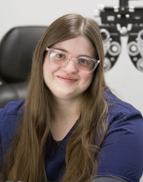 Woman with glasses sitting in a Boise optometrist's office.