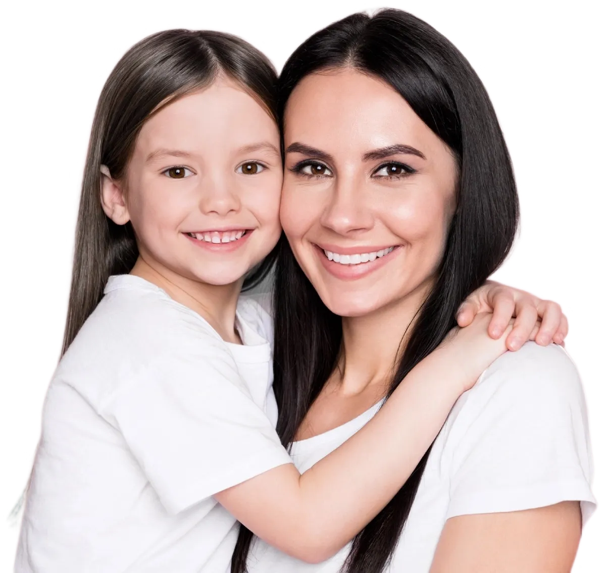 A young girl and an adult woman, both wearing white shirts, smile and pose together with their arms around each other against a plain background, capturing the warmth of family in Idaho Falls.