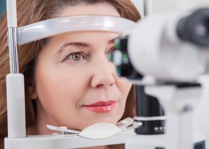 A woman is looking at eye exams.