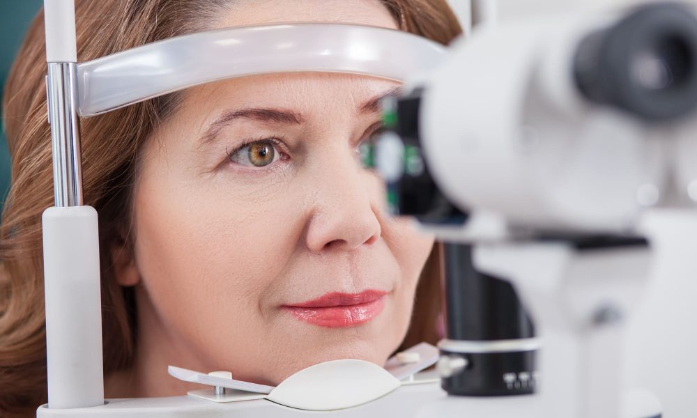 A woman is looking at eye exams.