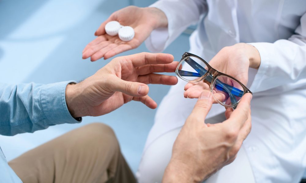 A patient choosing between contact lenses and blue light glasses during an eye care consultation at The Eye Pros. Expert guidance for better vision.