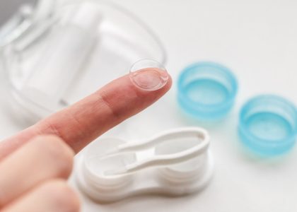 A person is wearing a pair of contact lenses.
